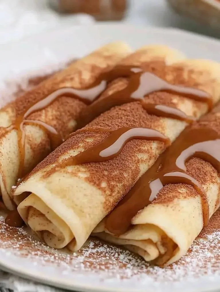 A plate of French toast with syrup.