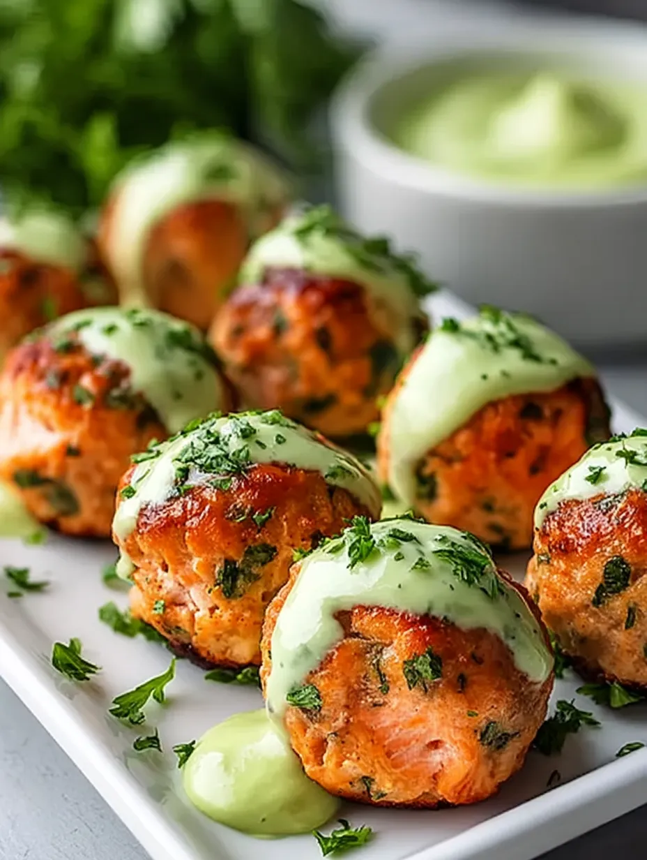 A plate of meatballs with sauce.