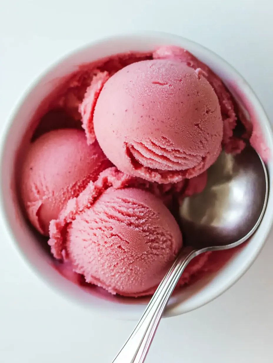 A bowl of pink ice cream.