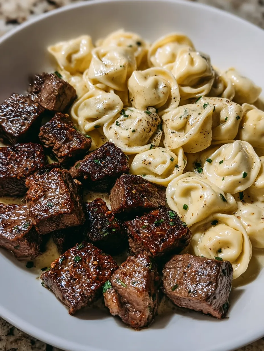 A plate of food with meat and pasta.