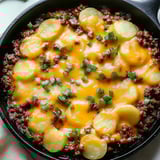 A bowl of food with a spoon in it.