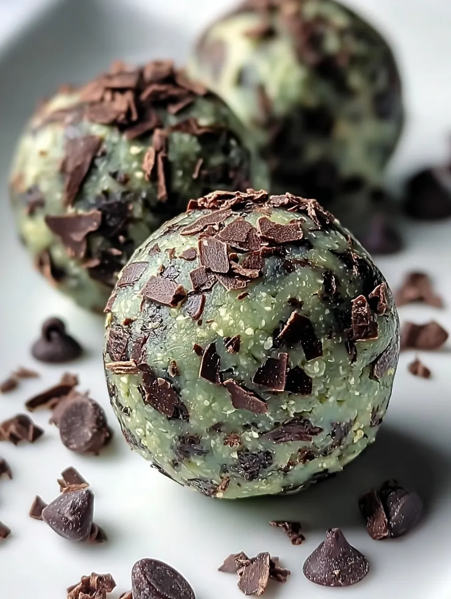 Two chocolate-covered chocolate treats next to each other.