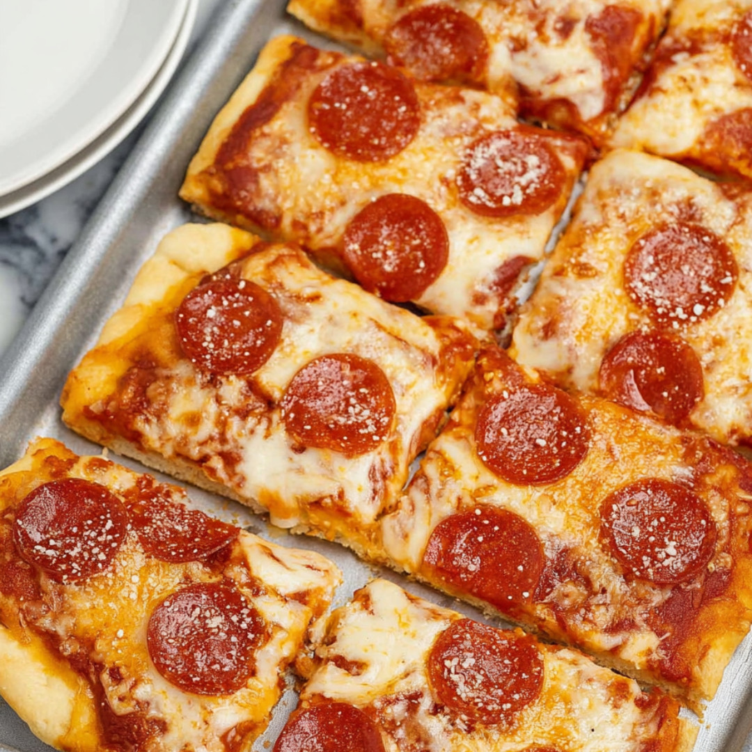 A pan of pepperoni pizza slices.