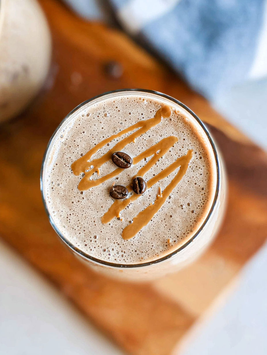 A glass of coffee with a caramel drizzle.