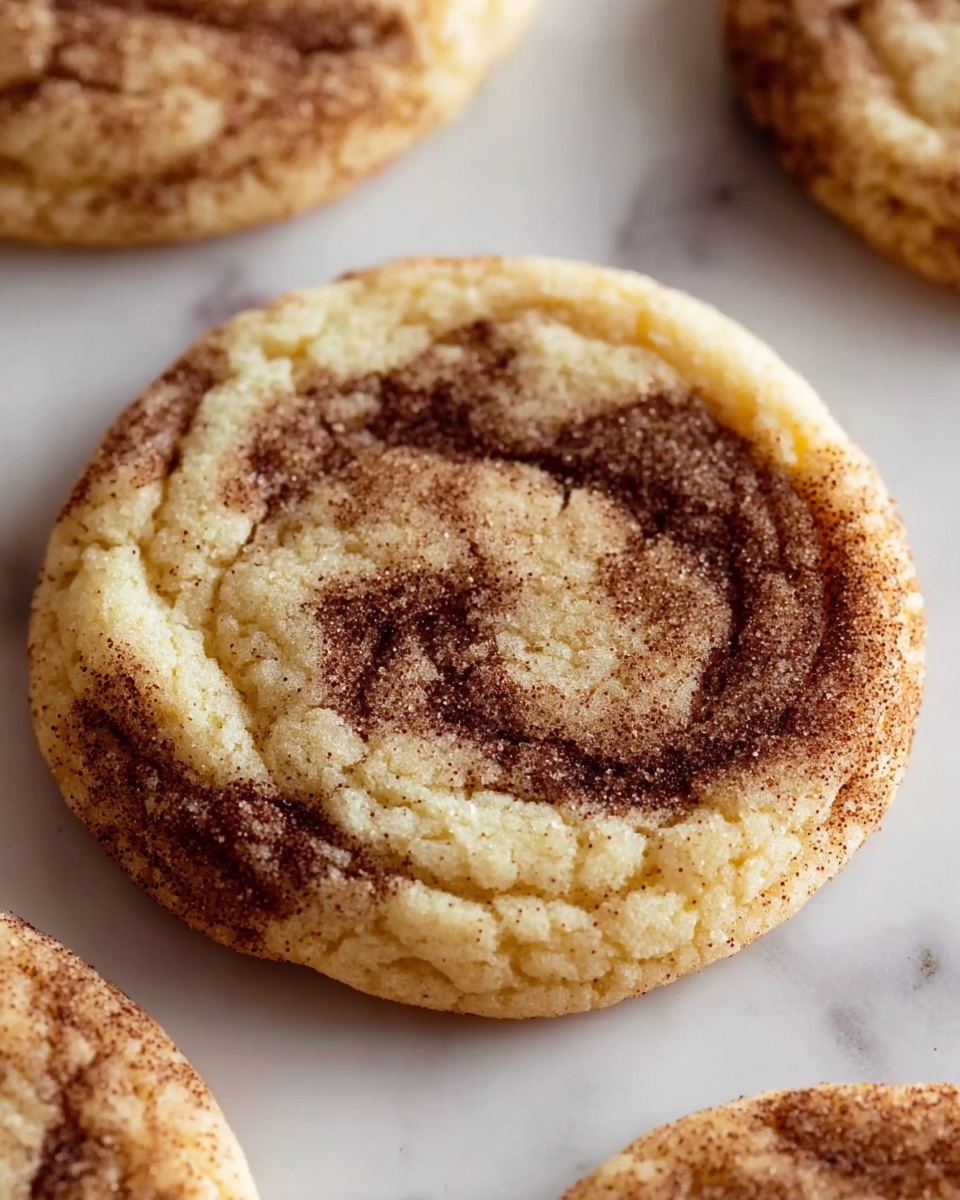 A close up of a cinnamon roll sugar cookie.