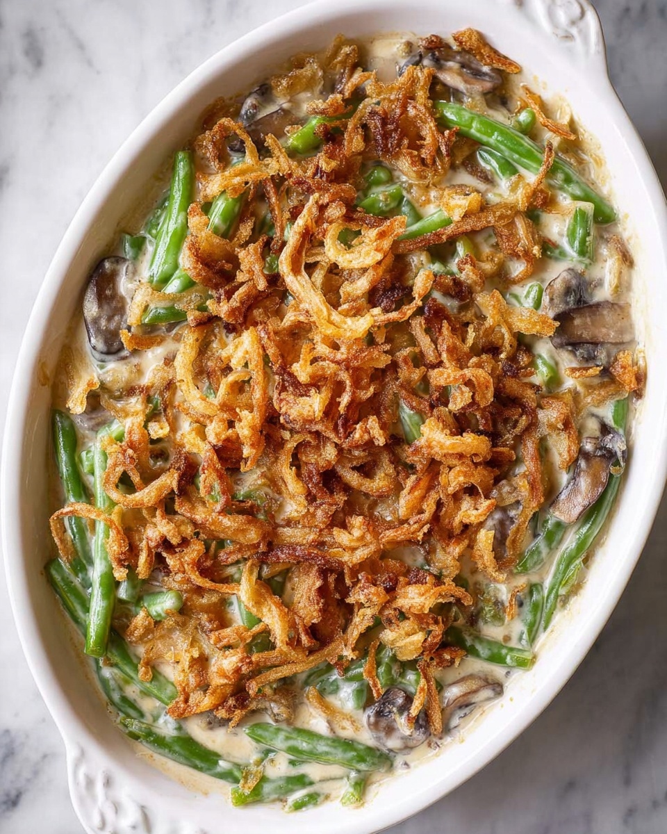 A white bowl filled with green beans and onions.