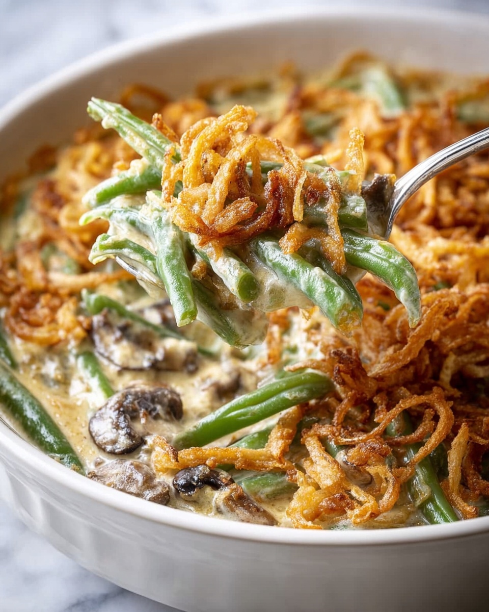 A bowl of food with a spoon in it.