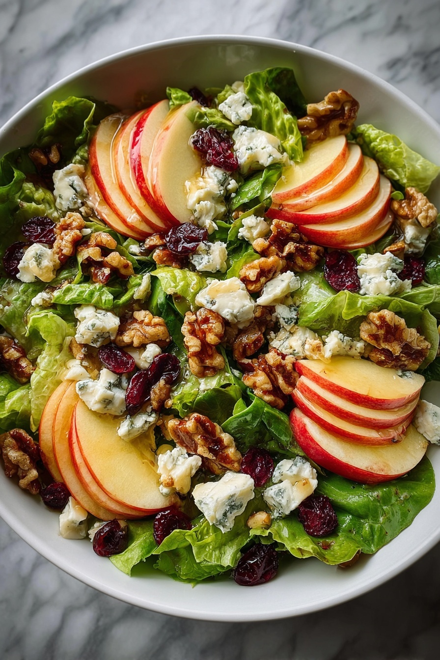 A salad with apples, walnuts, and blue cheese.