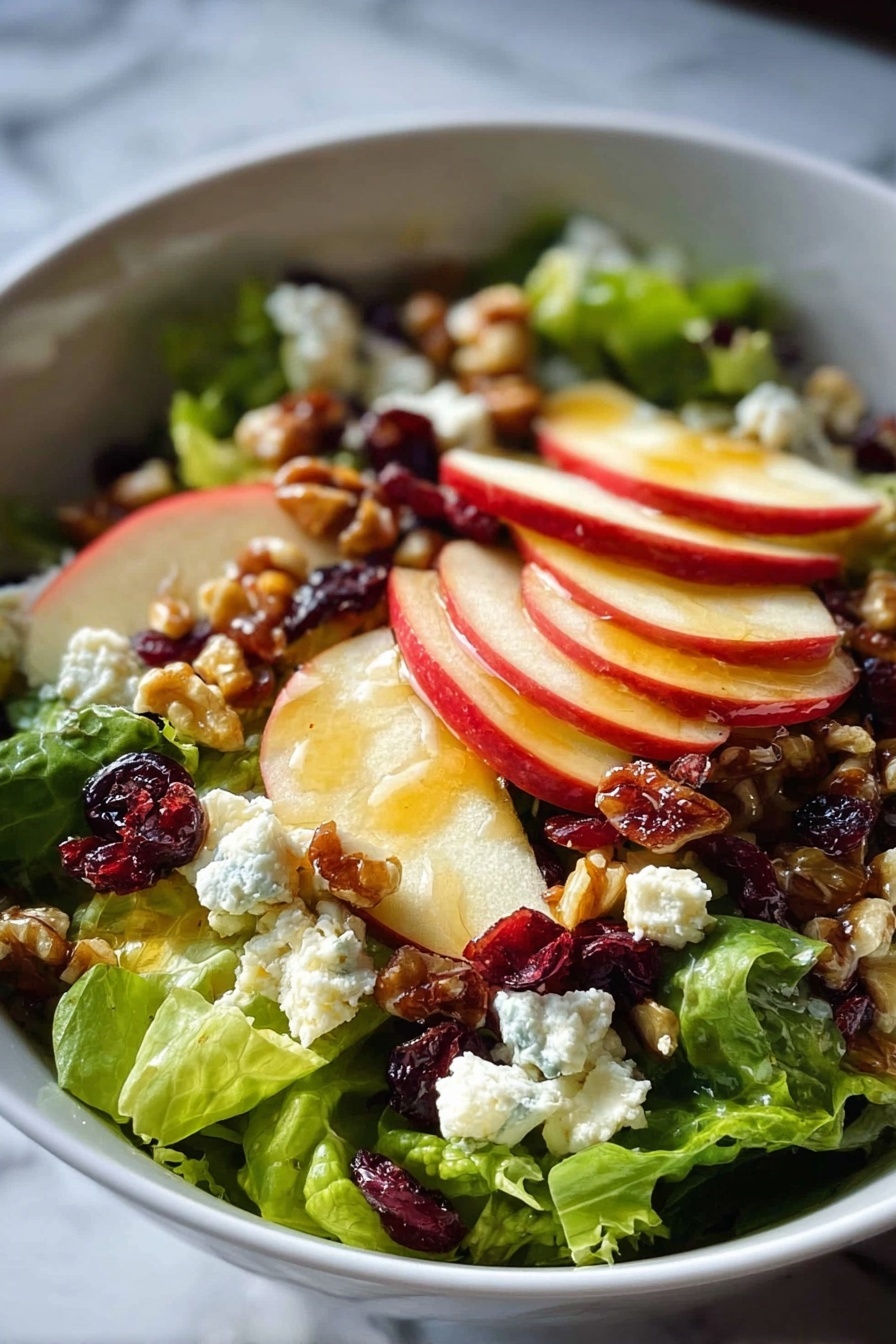 A salad with apples, walnuts, and blue cheese.