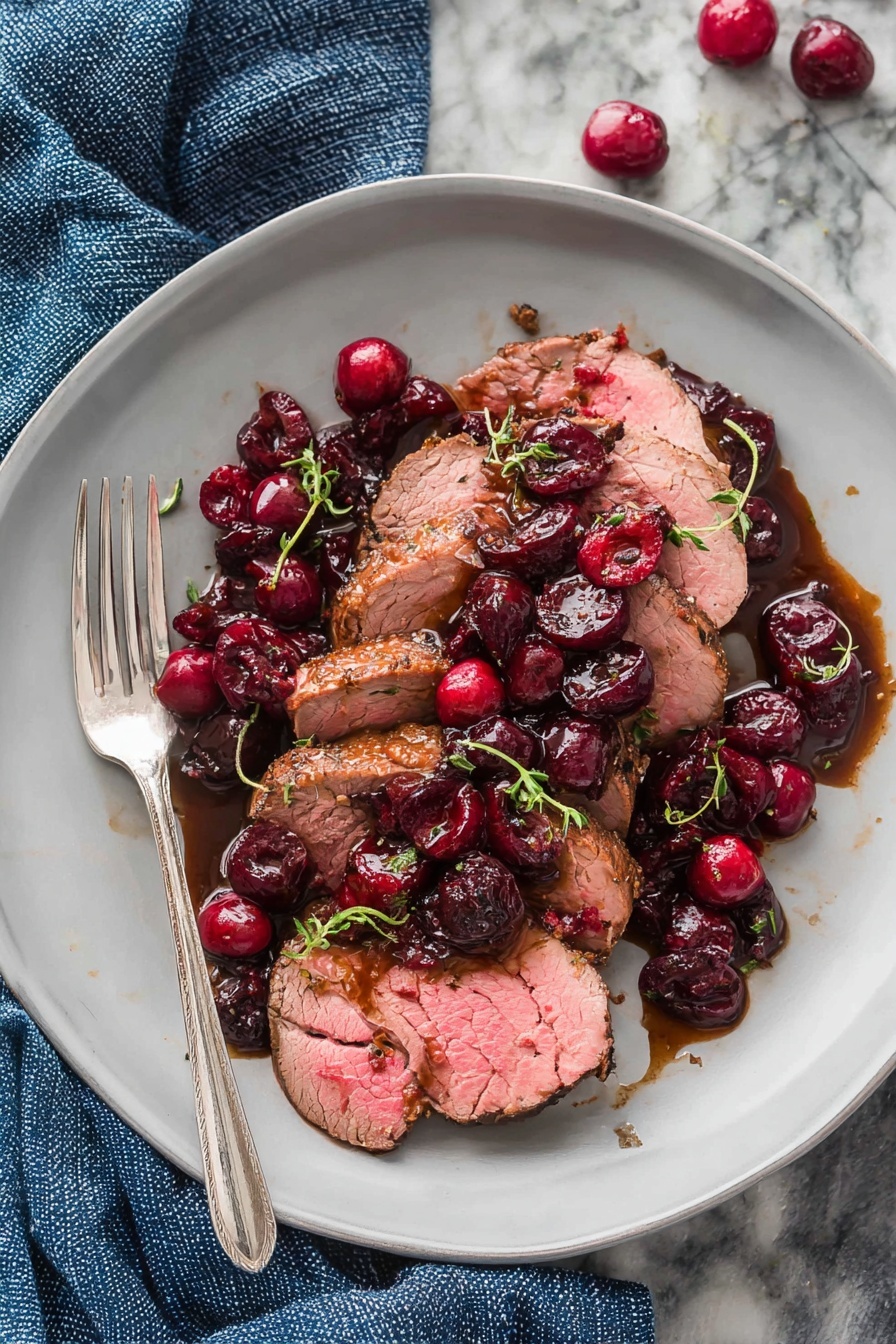A plate of roast beef with cranberries and balsamic sauce.