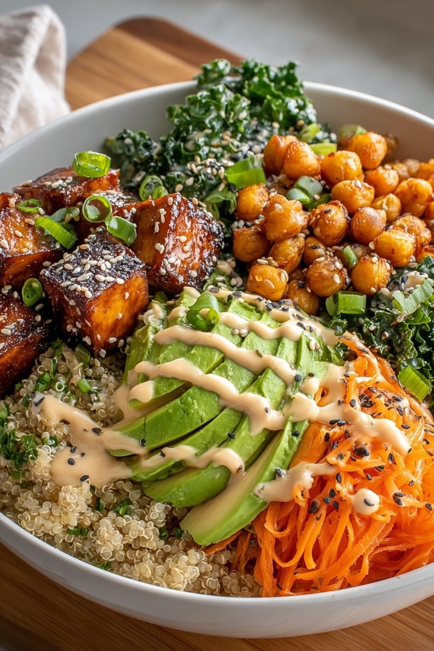 A bowl of food with a variety of ingredients including sweet potatoes, avocado, and carrots.