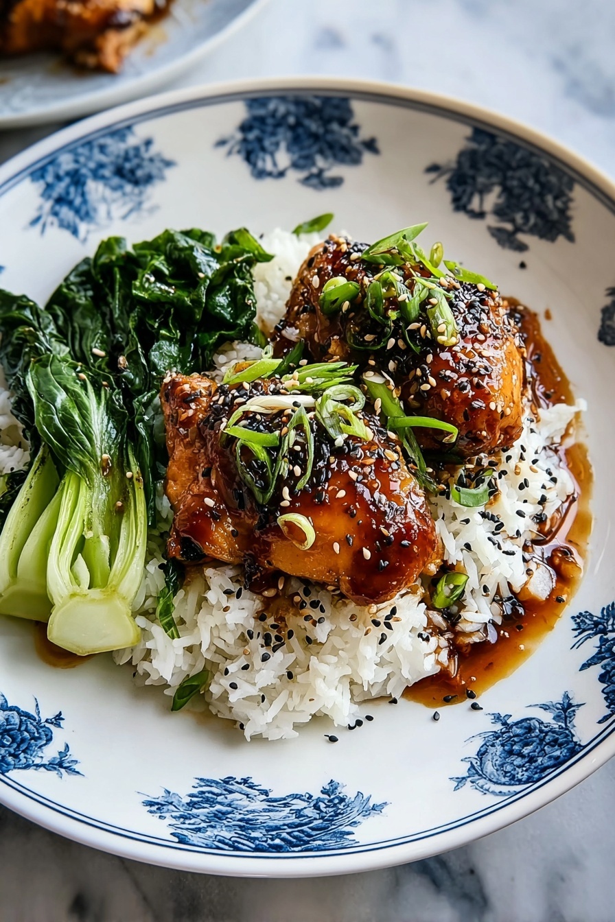 A plate of food with rice, chicken, and greens.