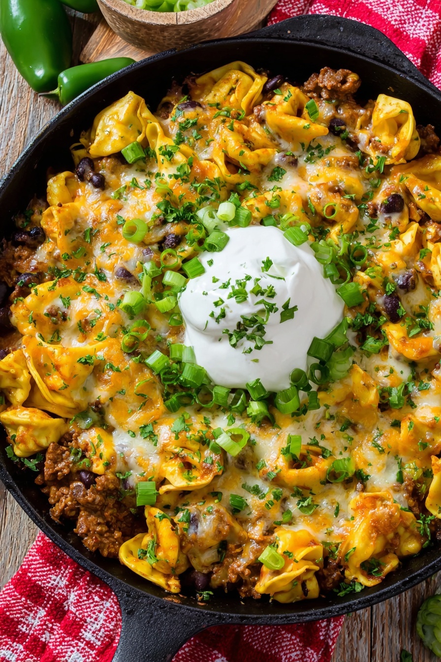 A delicious cheesy beef enchilada tortellini skillet.