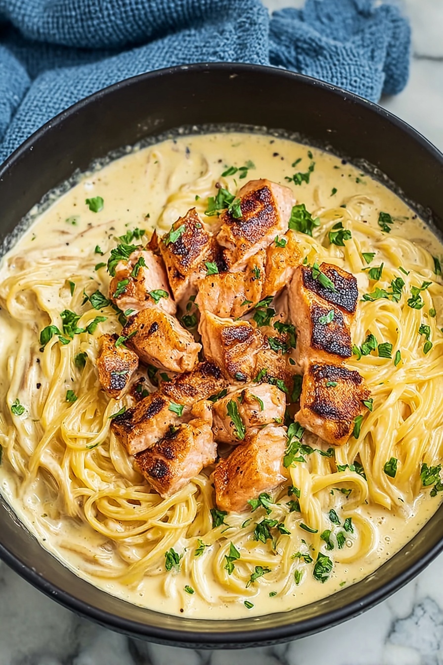 A bowl of salmon pasta.