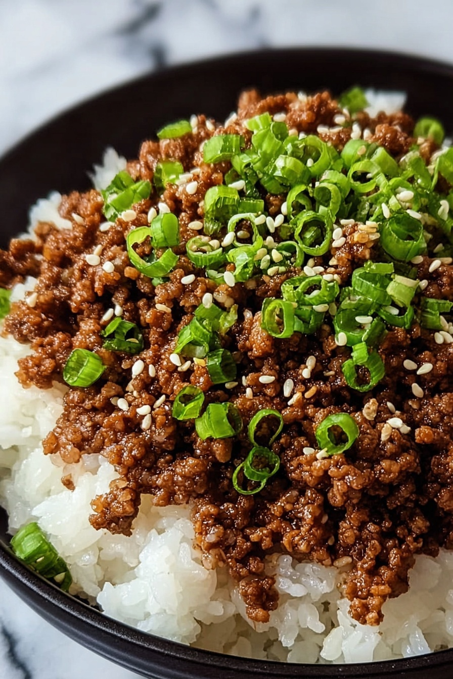 A bowl of Korean ground beef with green onions.
