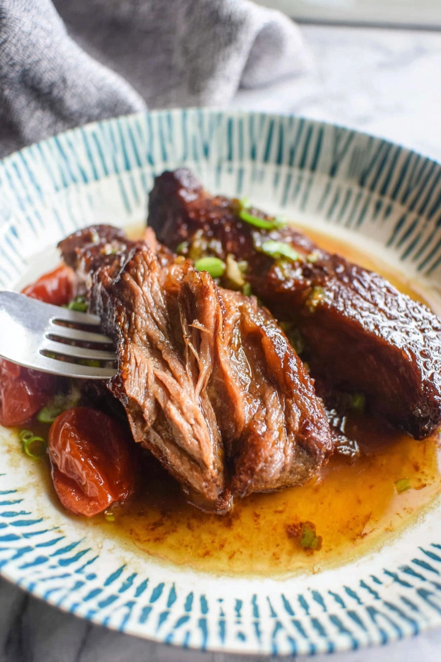 A plate of food with a fork on it.
