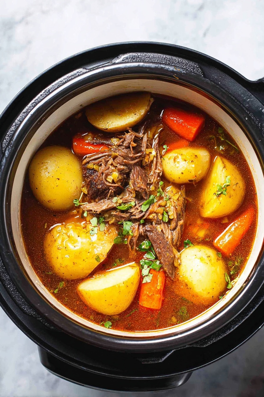 A bowl of soup with meat and vegetables.