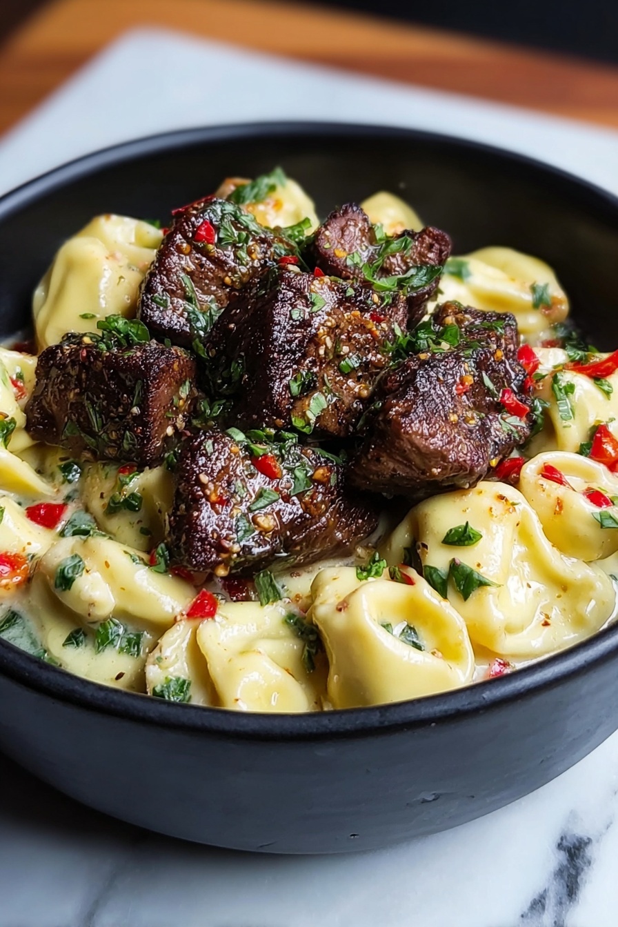 A bowl of garlic steak tortellini.
