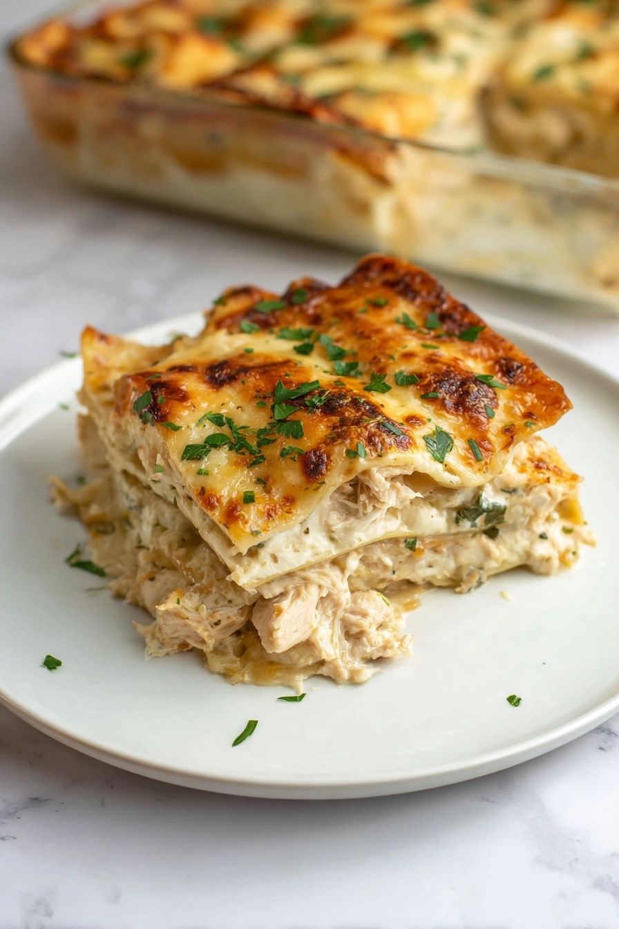 A plate of chicken Alfredo lasagna.