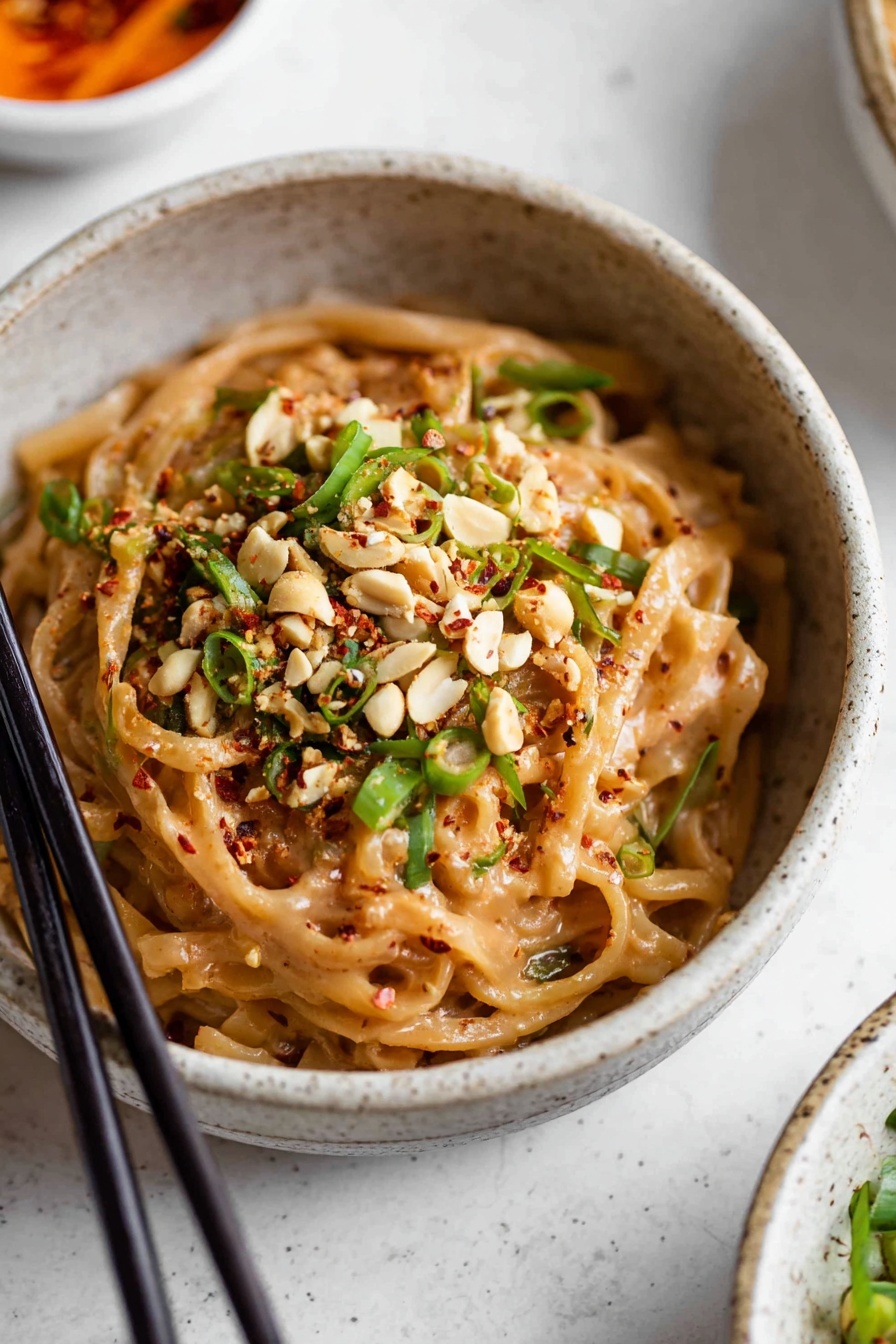 A bowl of spicy peanut butter noodles.