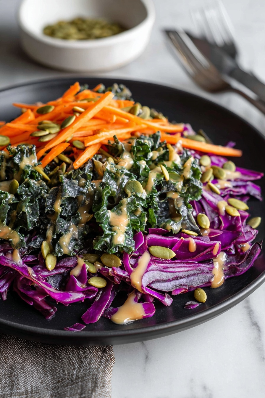 A plate of kale salad with a harissa dressing.