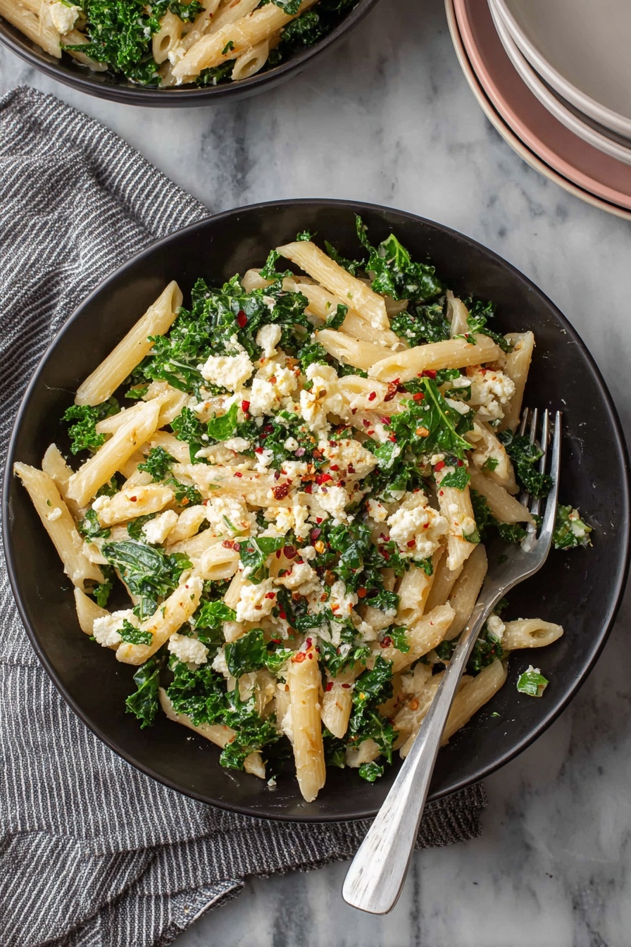 A bowl of pasta with vegan ricotta cheese.