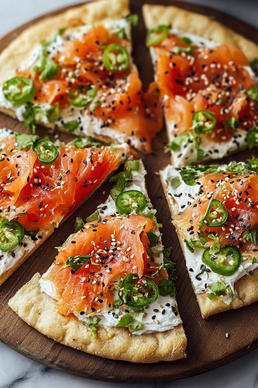 Sushi pizza with black sesame seeds.