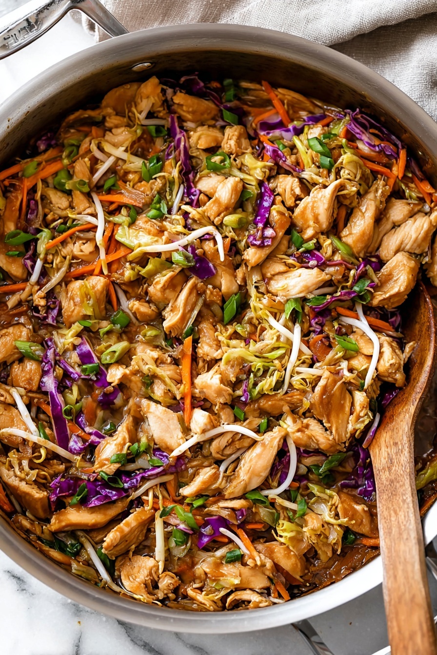 A bowl of Moo Shu Chicken with vegetables.