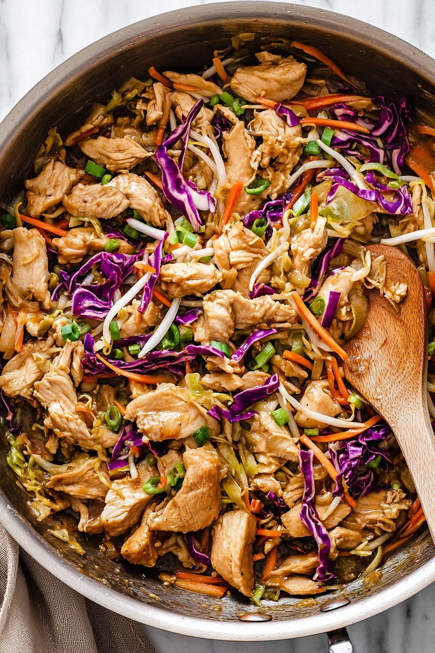 A bowl of Moo Shu Chicken with vegetables.