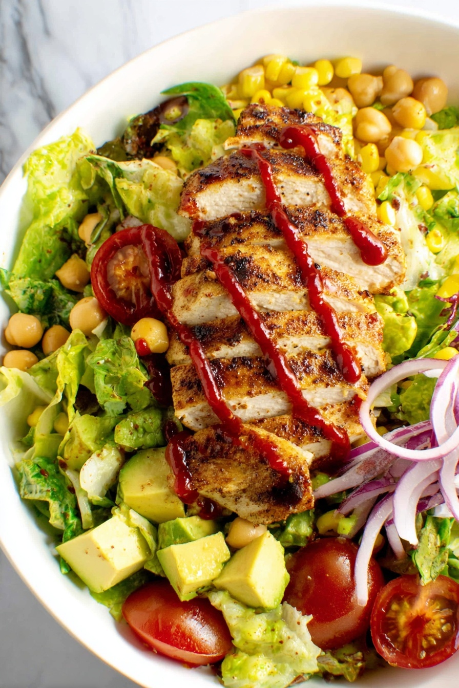 A plate of food with chicken and lettuce.