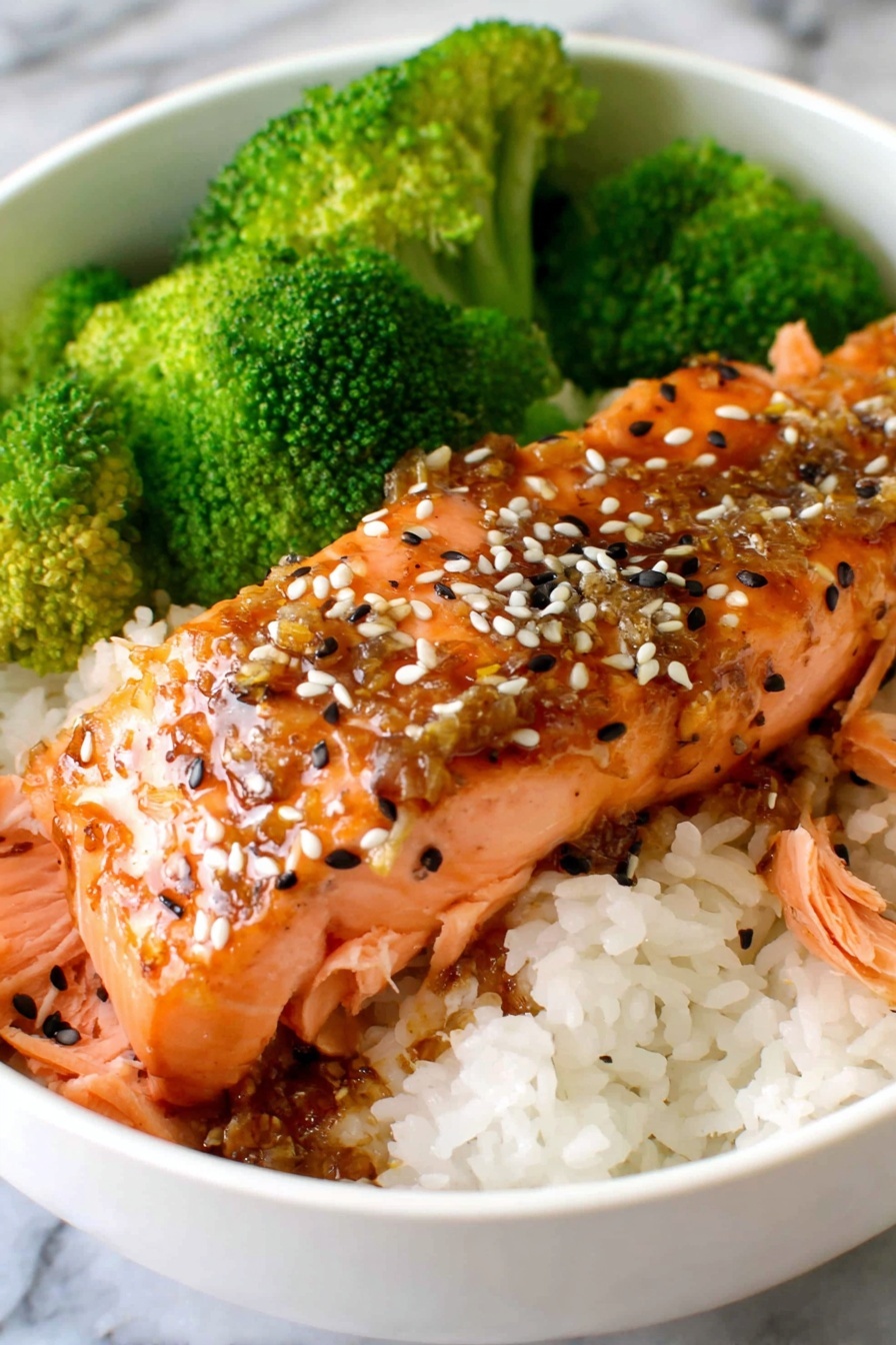 A bowl of food with rice and broccoli.