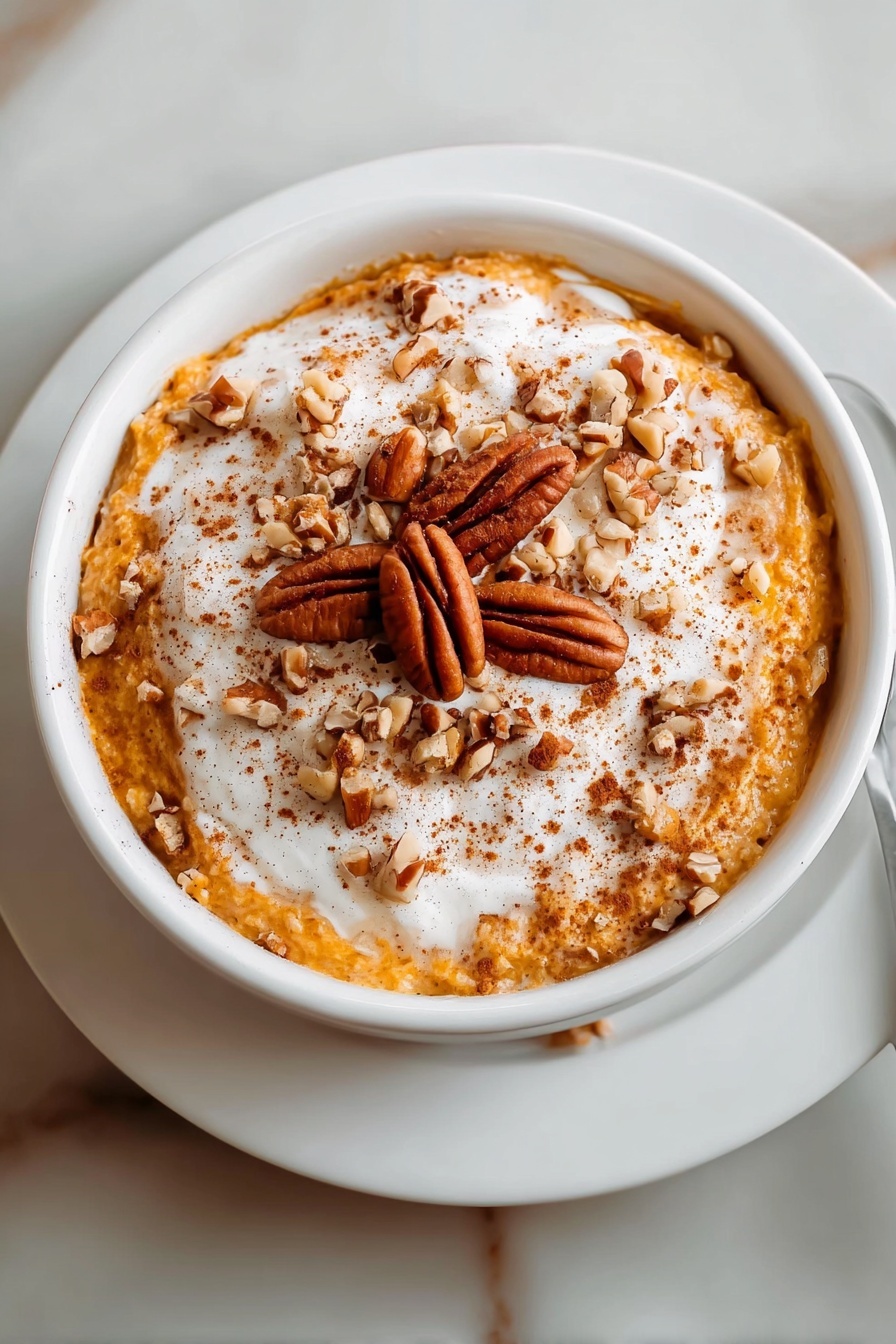 A bowl of pumpkin cheesecake overnight oats.