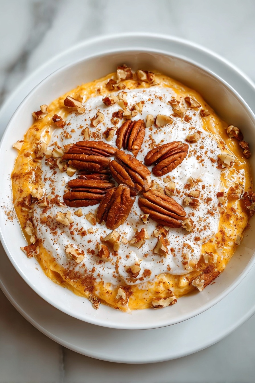 A bowl of pumpkin cheesecake oatmeal.