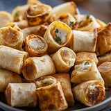 A plate stacked with all kinds of tasty bites.