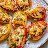 A plate of grilled peppers with cheese.
