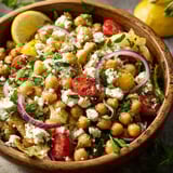 A bowl of vegetables with feta cheese.