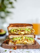 A grilled cheese sandwich with bacon and egg.