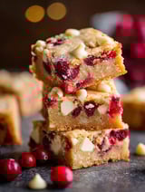 A stack of cranberry white chocolate blondies.