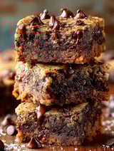 Three pieces of chocolate cake with chocolate drizzle.