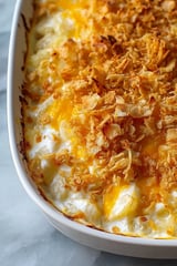 A dish of cheesy potatoes.