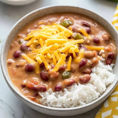 A bowl of soup with rice and beans.