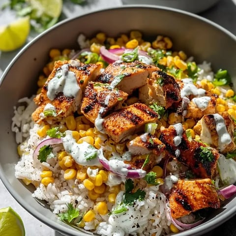 A bowl with rice, chicken, corn, plus onions, all mixed together.