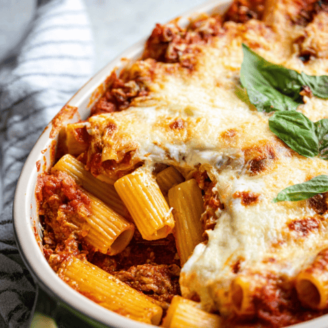 Pasta bowl with spinach and melty cheese.