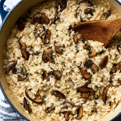A bowl of rice with mushrooms.