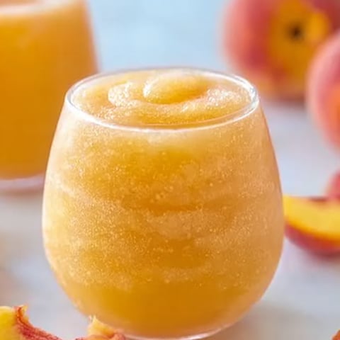 A glass packed with peach juice.