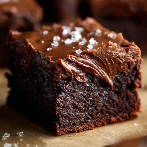 A slice of chocolate cake with chocolate frosting.