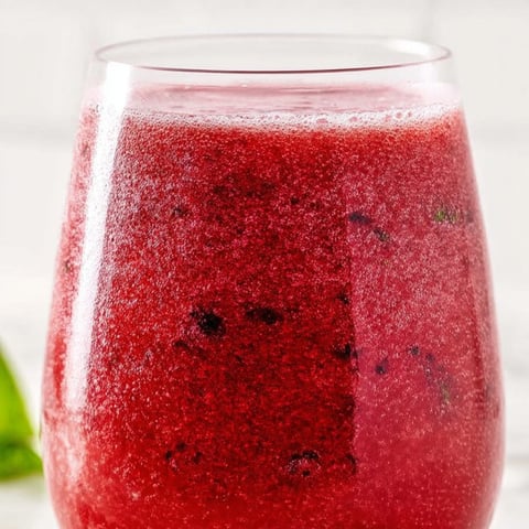 A glass of red juice.
