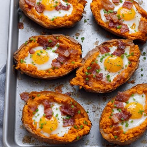 Bacon and egg potatoes on a tray.