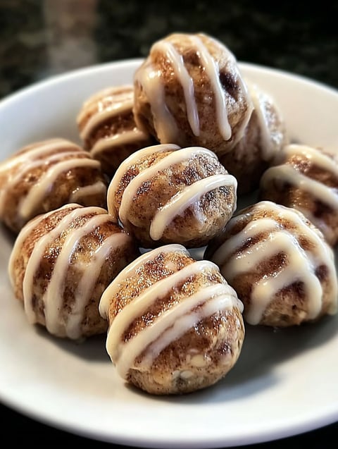 A plate of cinnamon roll protein bites.
