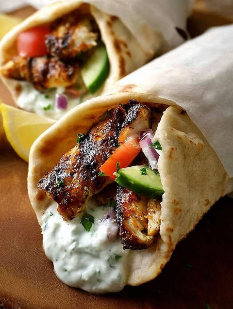 A gyro with chicken and vegetables.